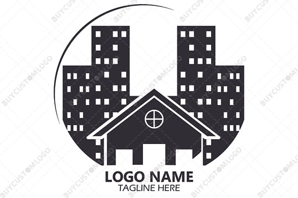 hut and high rise buildings in night logo