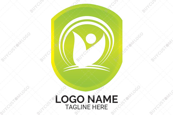 abstract person leaves and circles in a shield logo