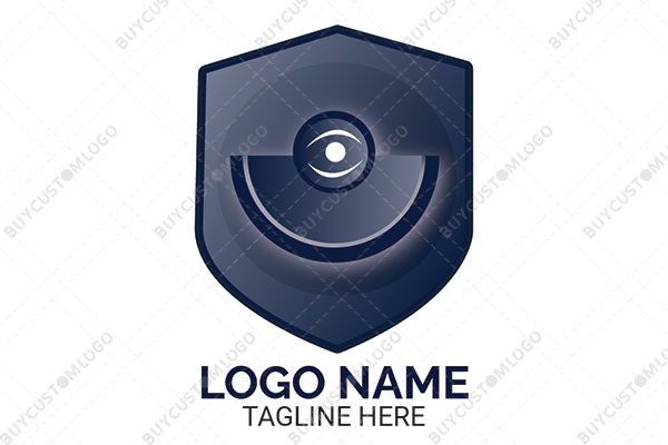 eye and camera lens in a shield logo
