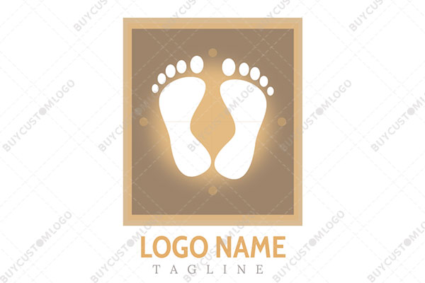 footprints in a frame white and sand yellow logo