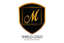 letter m in a shield golden and black logo